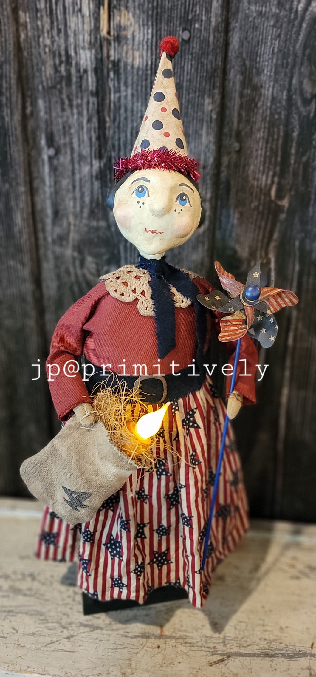 Patriotic lady with bag and candle